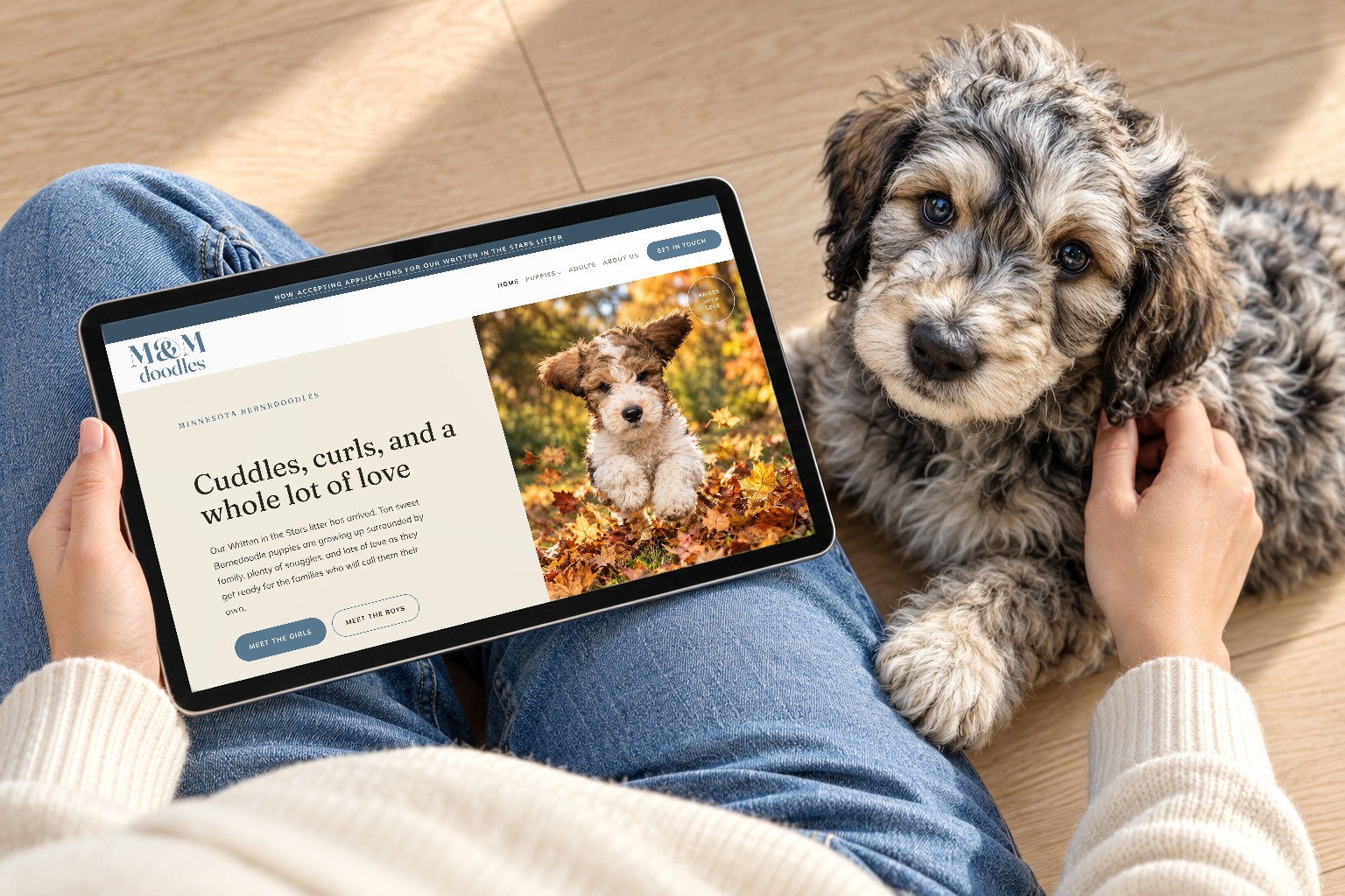 A site on a tablet beside a puppy