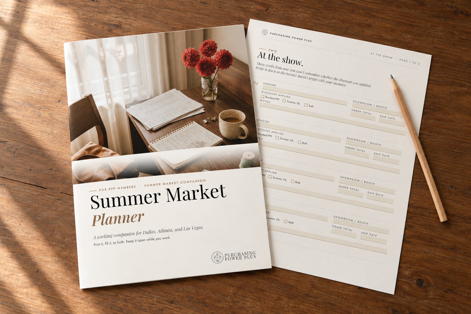 A market planner open on a wooden table with a pencil